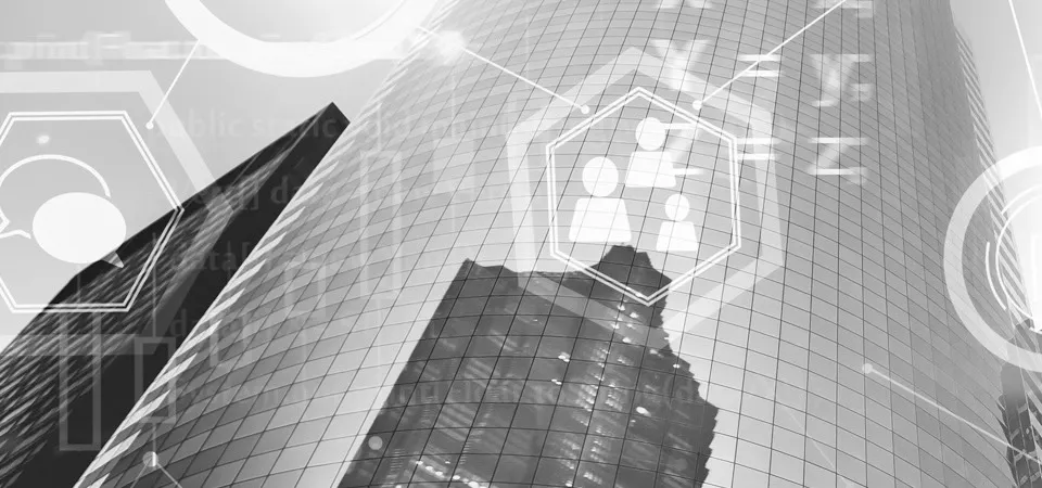 Two persons discussing content shown on a screen